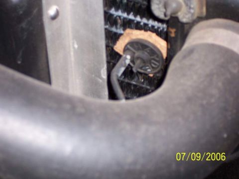 1983 Ford Bronco - Temperature probe is mounted directly under the return water hose. It is isolated from air flow by a small disc that covers the fins of the…