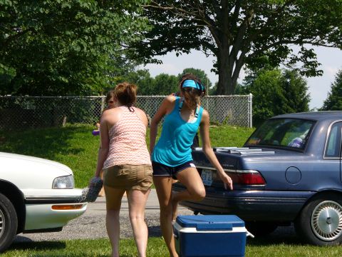 1991 Ford Probe - A blue sedan and a white car are parked on a sunny day with two women standing between them.