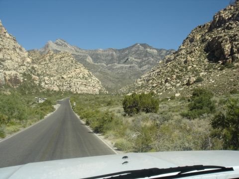 1996 Ford Bronco - A scenic drive through a mountainous landscape on a clear day.