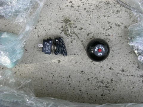 1996 Ford Probe - A black shift knob with 'GO BABY 09' text and a toggle switch are shown, likely for a vehicle modification.