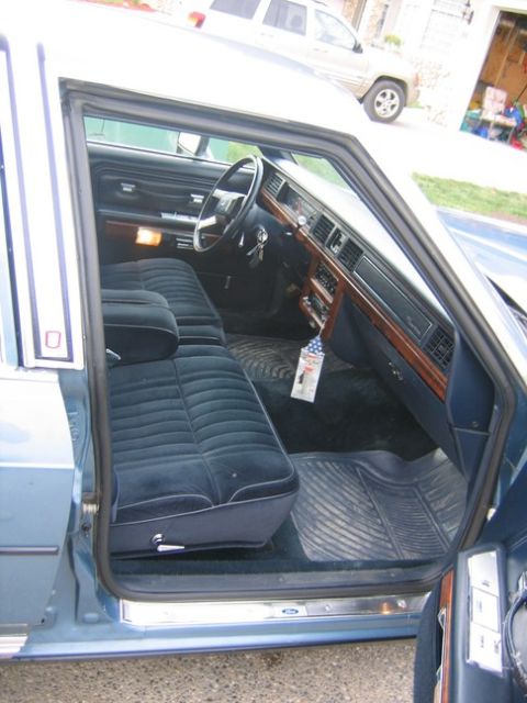 1988 Ford Crown Victoria LTD - Interior of a 1988 Ford Crown Victoria LTD, showing the front seats and dashboard.