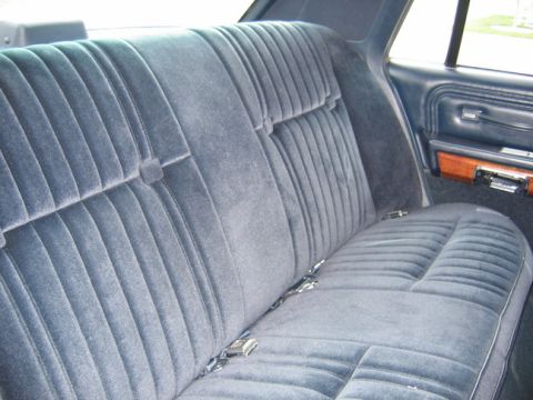1988 Ford Crown Victoria LTD - Rear velour seat interior of a 1988 Ford Crown Victoria LTD.