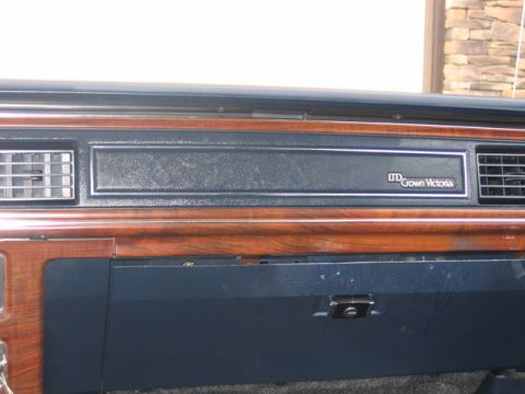 1988 Ford Crown Victoria LTD - Dashboard trim of a 1988 Ford Crown Victoria LTD shows the model name badge.
