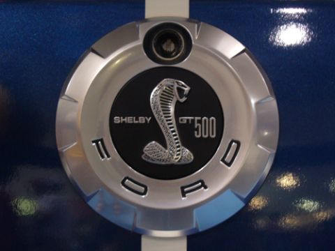 1995 Ford Taurus - Close-up of a Shelby GT500 badge on the side of a blue vehicle.