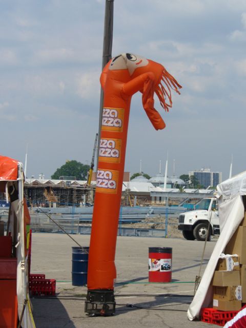 1995 Ford Taurus - An inflatable tube man advertises pizza, with a white truck visible in the background.