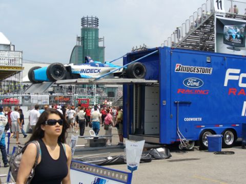 1995 Ford Taurus - Race car being loaded into a Ford Racing trailer at a track event.
