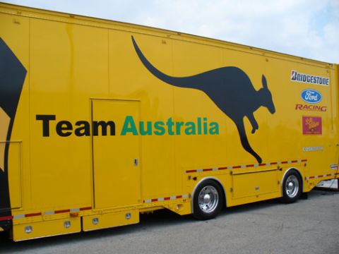 1995 Ford Taurus - A yellow trailer displays the "Team Australia" logo along with a kangaroo graphic and sponsor decals.