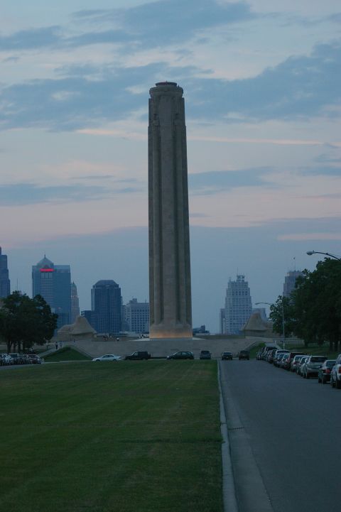 1998 Jeep TJ - The Liberty Memorial Tower stands tall against a cloudy sky, with a row of parked cars lining the adjacent road.
