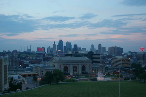 1998 Jeep TJ - The Kansas City skyline is visible at dusk, with Union Station and a fountain in the foreground.