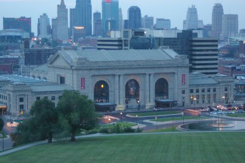 1998 Jeep TJ - A view of the Kansas City skyline and Union Station at dusk, with a fountain visible.