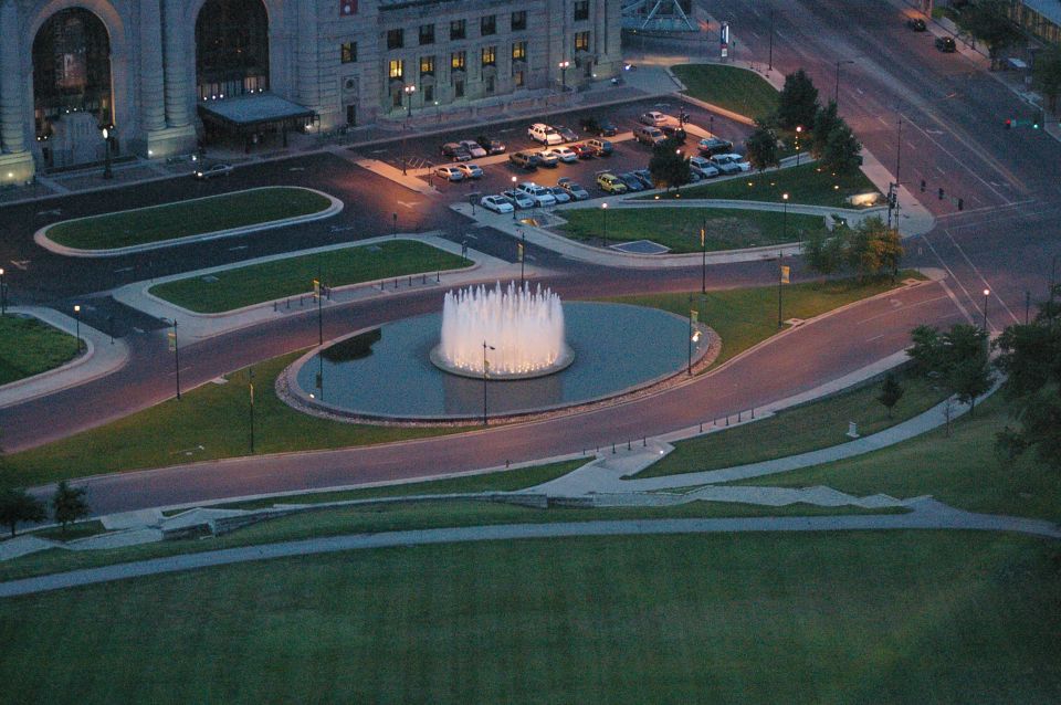 Parking lot and fountain scene with multiple cars