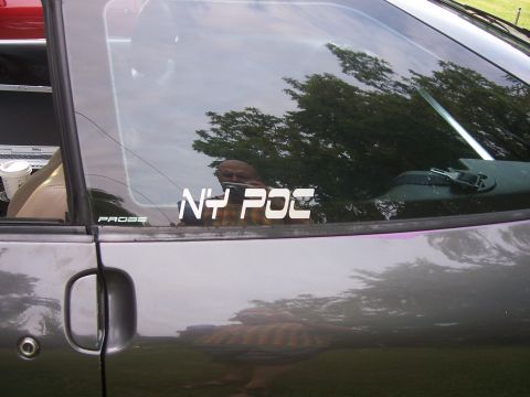 1996 Ford Probe - A side view of a gray car shows "PROBE" and "NY POC" stickers on the window.