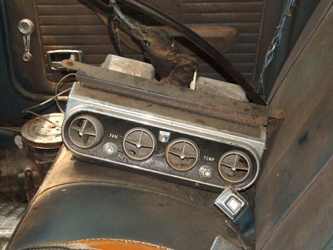 1966 Ford Ranchero - Close-up of an old car's interior, focusing on an aftermarket air conditioning unit.