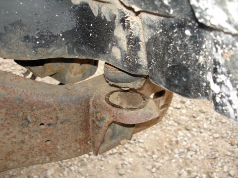 1987 Ford Bronco - This image shows a rusted suspension part, not a complete vehicle.