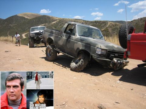 1989 Ford Bronco - A modified Ford Bronco is shown on a dirt path with other vehicles and a mountainous background.