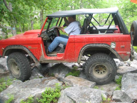 1992 Ford Bronco - This classic Ford Bronco navigates a rocky trail, its off-road capabilities.