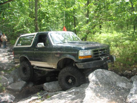1992 Ford Bronco - This 1992 Ford Bronco tackles a challenging off-road course, demonstrating its capabilities.
