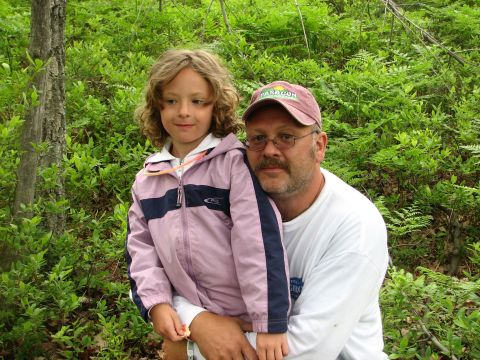 1992 Ford Bronco - A man and a young girl pose for a photo in a dense forest setting.
