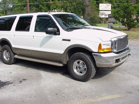 2000 Ford Excursion - This 2000 Ford Excursion SUV is shown from a 3/4 front angle, highlighting its two-tone paint scheme.