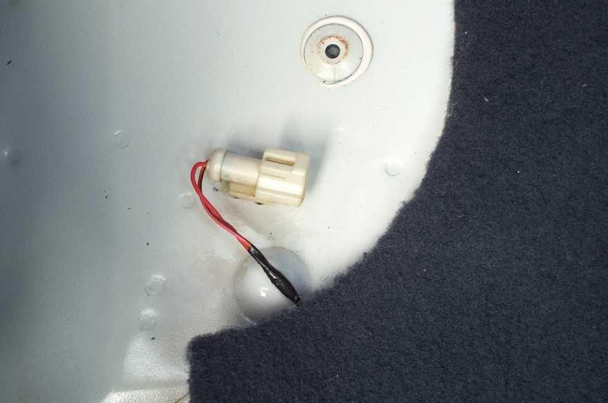 Found this connector under the rear seat's carpeting and padding. There is one on each side. What is their purpose?