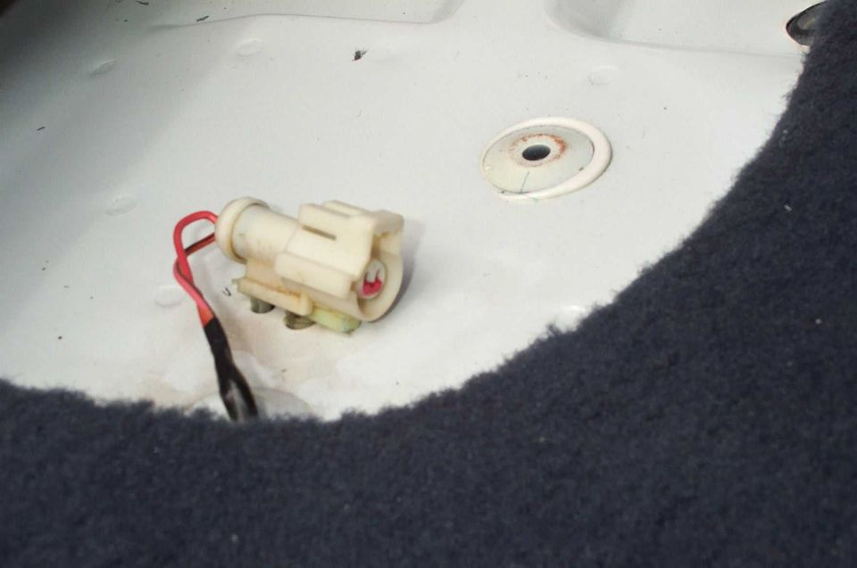 Electrical connector with red wire in white housing