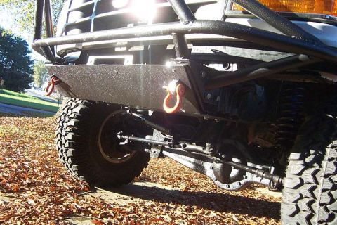 1996 Ford Bronco - Close-up view of a truck's front bumper and suspension system, with a watermark at the bottom right.