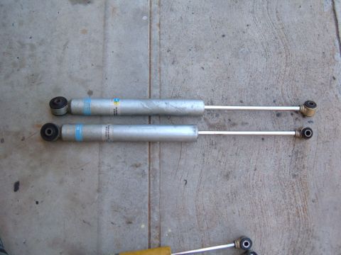 1985 Ford Bronco II - Two Bilstein shock absorbers are shown laid out on a concrete surface. The registry claims they are for a 1985 Ford Bronco II, but this can…