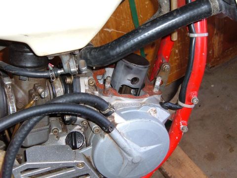 1985 Ford Bronco II - This image shows a close-up view of a motorcycle's engine components, including the cylinder and carburetor.