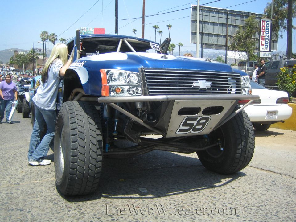 Blue Chevrolet prerunner race truck no. 58 with tube bumper and bypass shocks