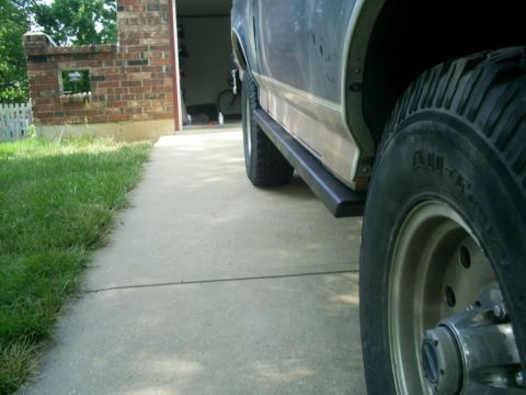 1994 Ford Bronco - Side view of a 1994 Ford Bronco, focusing on the running board and wheel.