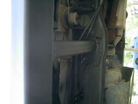 1994 Ford Bronco - Close-up of the undercarriage, showing the frame and suspension system of a vehicle.