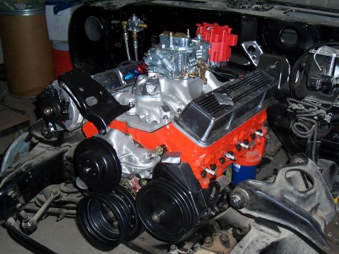 1979 Chevrolet Camaro - Close-up of a Chevrolet V8 engine assembly, showing the carburetor, distributor, and valve covers.