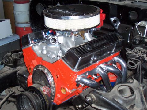 1979 Chevrolet Camaro - Close-up view of a modified V8 engine, chrome valve covers and an aftermarket air intake system.