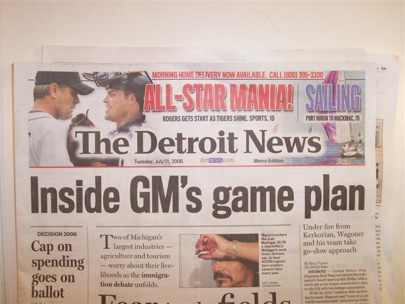 Newspaper front page with headline 'Inside GM's game plan' and 'The Detroit News' masthead