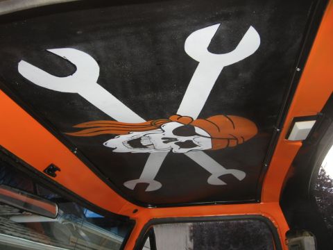1979 Ford Bronco - Custom skull and wrenches graphic painted on the interior headliner of a vehicle.