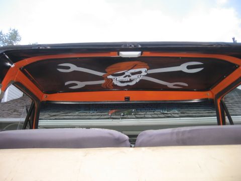 1979 Ford Bronco - The vehicle's interior features a custom headliner with a pirate-themed skull and crossed wrenches design.