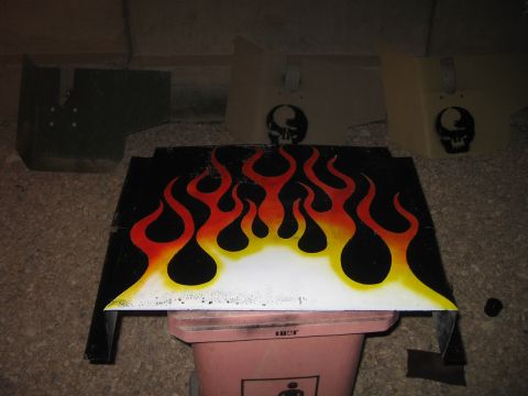 1979 Ford Bronco - Custom painted car part with flame graphics and skull decals, likely for a hot rod or custom build.