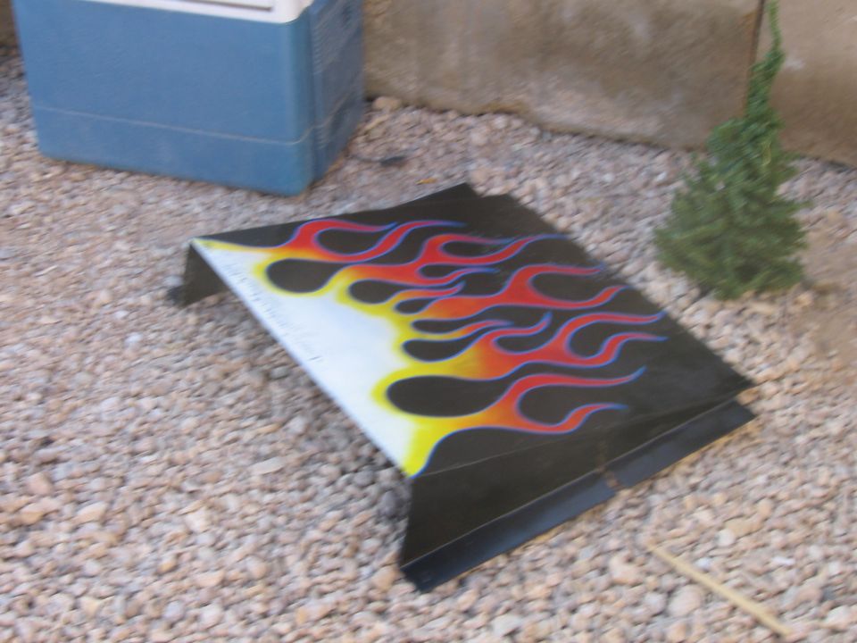 Black part with yellow, red, and blue flames