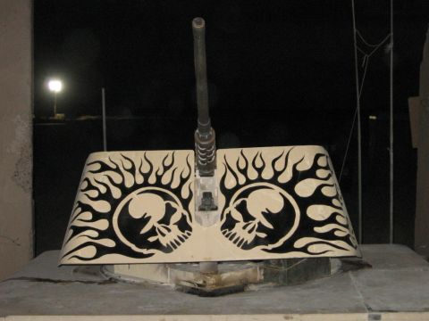 1979 Ford Bronco - This tank turret features custom skull and flame graphics, with a visible gun barrel.