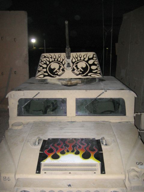 1979 Ford Bronco - This Humvee has custom flame and skull decals, along with a mounted machine gun.