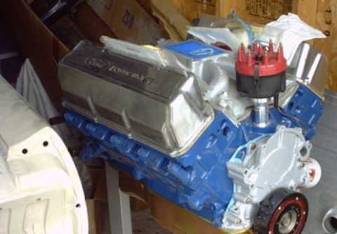 1994 Ford F-150 - A blue Ford engine with chrome valve covers and a red distributor cap is shown, with "SUPERMOTORS.NET" visible at the bottom.