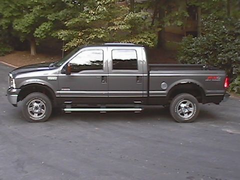 2005 Ford F-250 - Side view of a gray 2005 Ford F-250 Super Duty pickup truck with a crew cab.