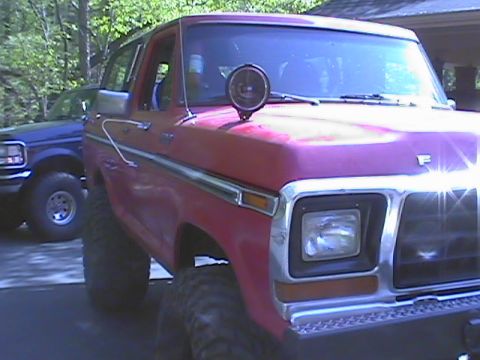1979 Ford Bronco - This red pickup truck appears to be from the late 1970s or early 1980s, not a 1979 Bronco.