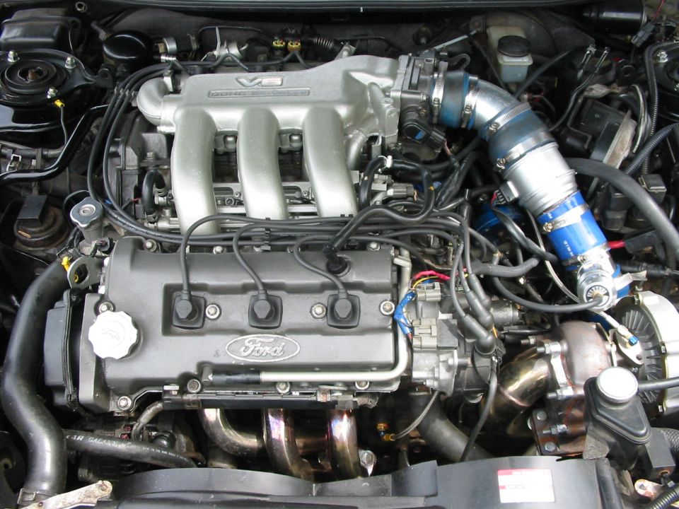 Ford V6 engine with turbocharger and aftermarket intake