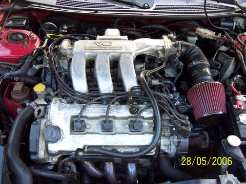1996 Ford Probe - Engine bay photo a Mazda V6 engine with an aftermarket air intake system.