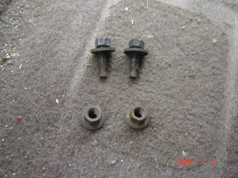 1993 Ford Bronco - Close-up view of hardware on a carpeted surface.