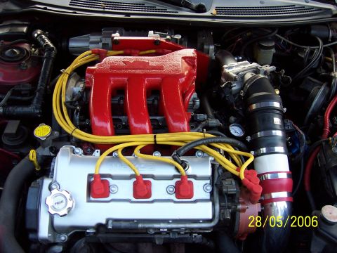 1996 Ford Probe - Close-up view of a car's engine bay, showing various components and wiring.