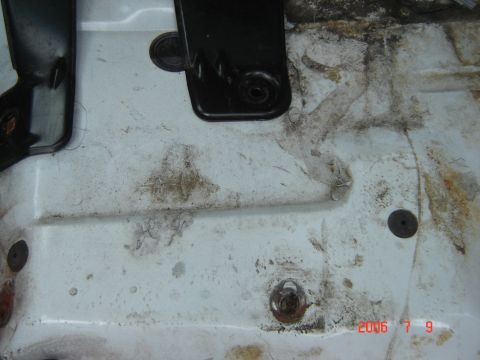 1993 Ford Bronco - The floor of the vehicle shows dirt and grime, with visible seat mounting points.