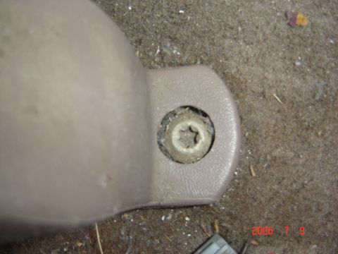 1993 Ford Bronco - Plastic seat bolt cover with a star-shaped bolt head.