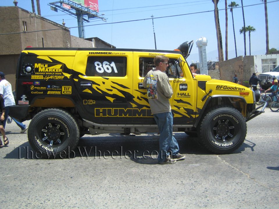 Yellow Hummer H2 race vehicle number 861 with black graphics and BFGoodrich tires